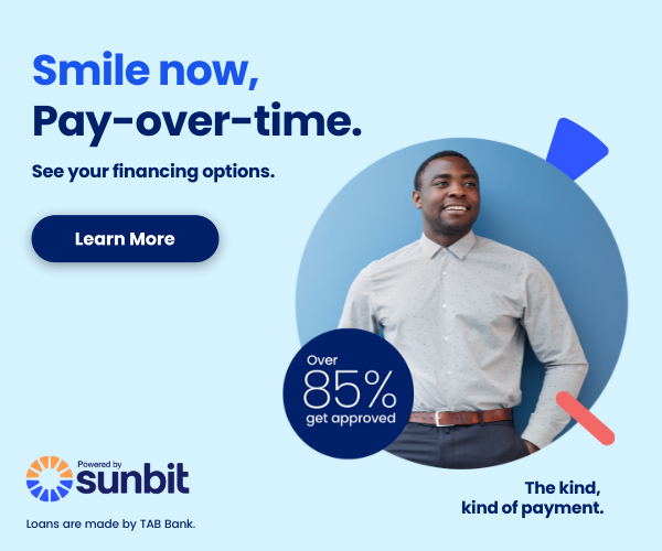Man in business casual shirt smiling, promoting Sunbit financing option with 85% approval rate for dental payments.