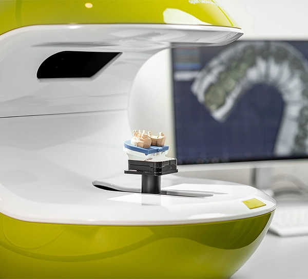 Dental CT scanner with patient positioning, modern dental imaging equipment in clinical setting.