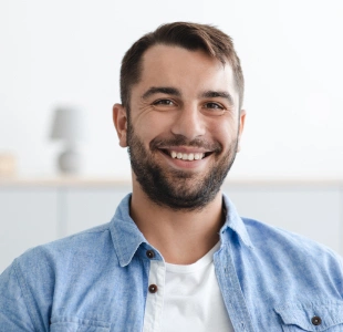 Patient smiling after restorative dental treatment